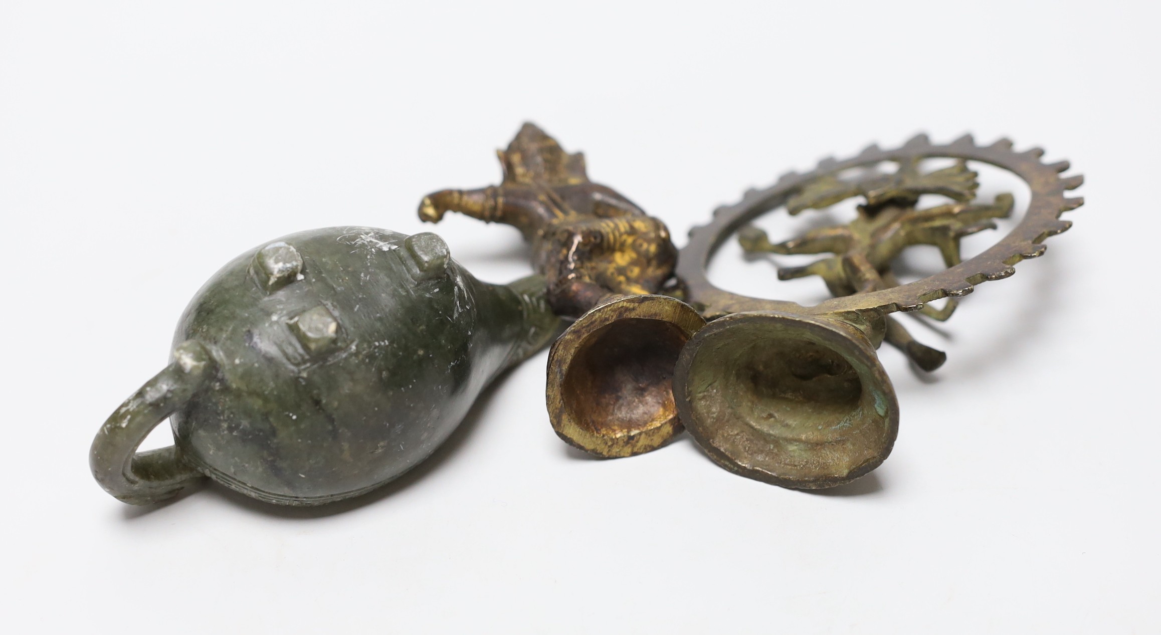 Two Indian bronze deity figures together with a Chinese carved spinach jade jug, tallest 11cm